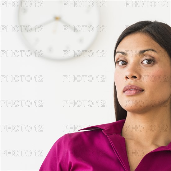 Portrait of young woman in office.