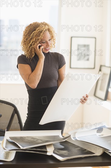 Young woman working in art gallery.