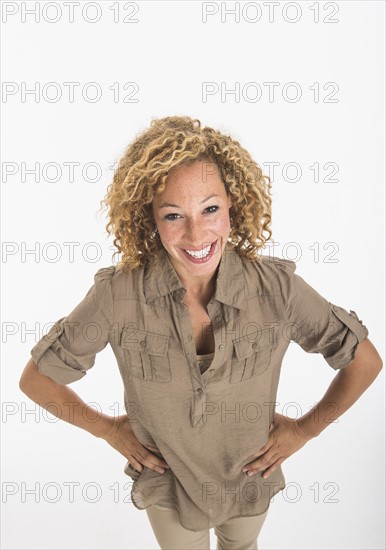 Portrait of young woman on white background, studio shot.