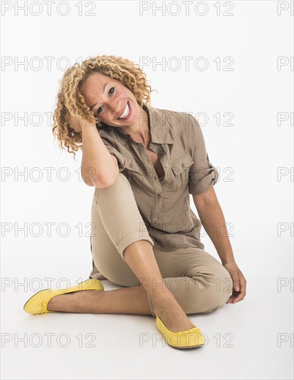 Portrait of young woman on white background, studio shot.
