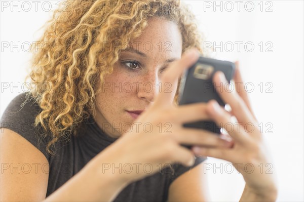 Businesswoman using smart phone.