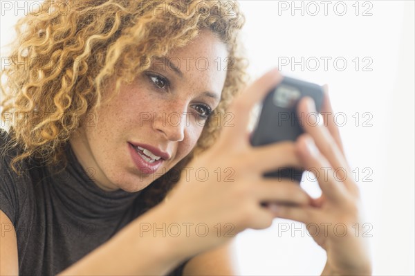 Businesswoman using smart phone.