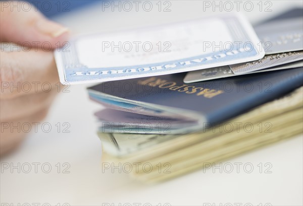 Close up of woman's hand holding Social Security Card.
