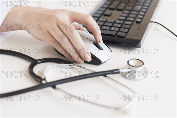 Doctor using computer.