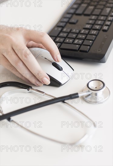 Doctor using computer.