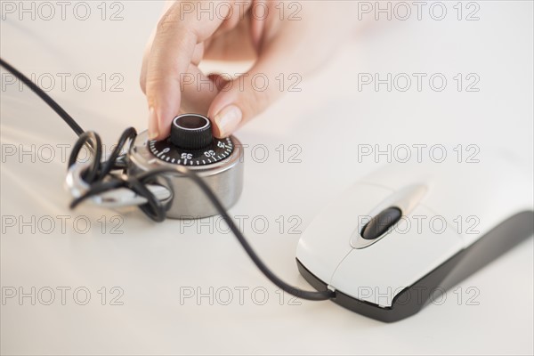 Computer mouse closed with combination lock.