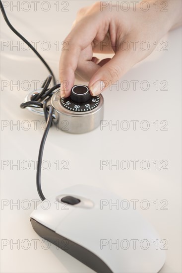 Computer mouse closed with combination lock.