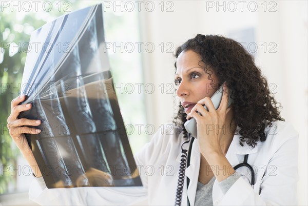 Doctor looking at MRI scan.