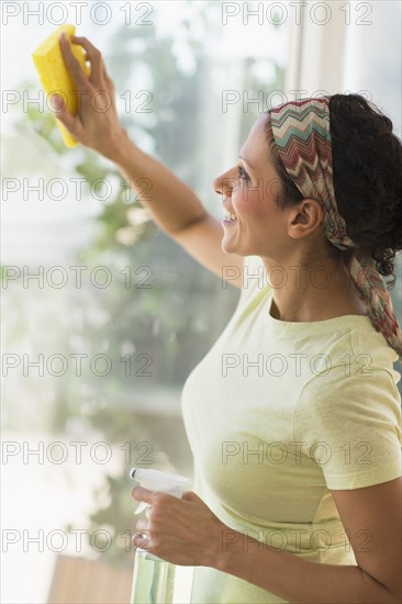 Woman cleaning window.