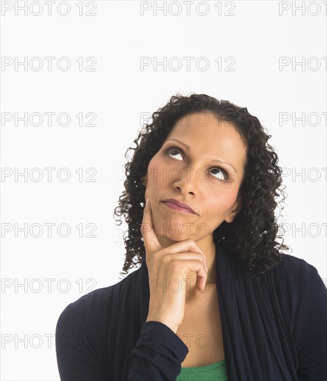 Studio shot of woman contemplating.