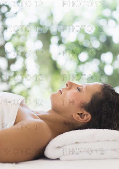 Woman relaxing in spa.