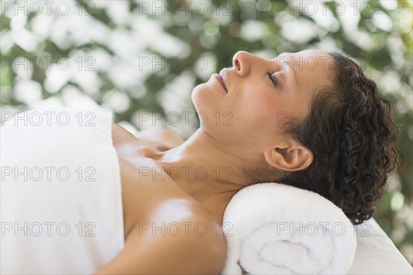 Woman relaxing in spa.