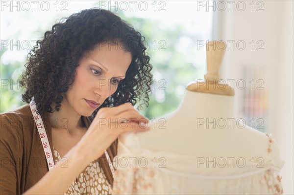 Portrait of clothes designer during work.