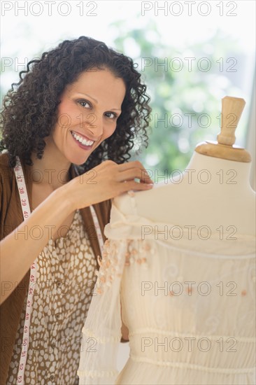 Portrait of clothes designer during work.