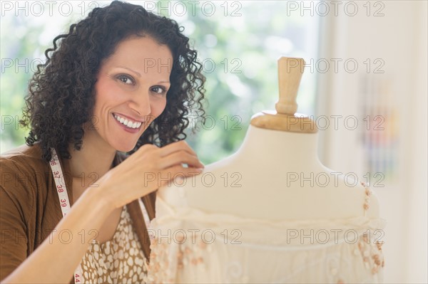 Portrait of clothes designer during work.