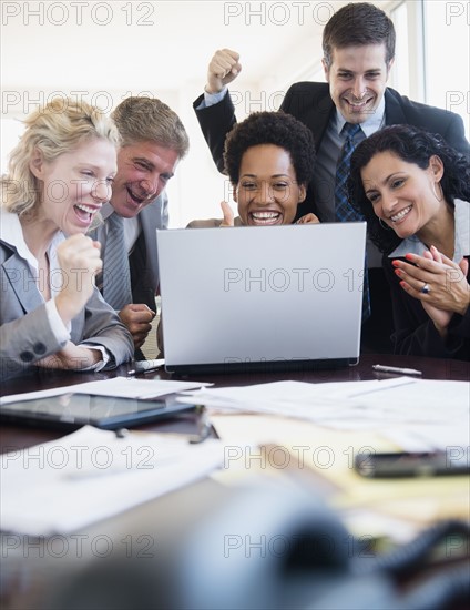 Office workers celebrating success. Photo: Jamie Grill