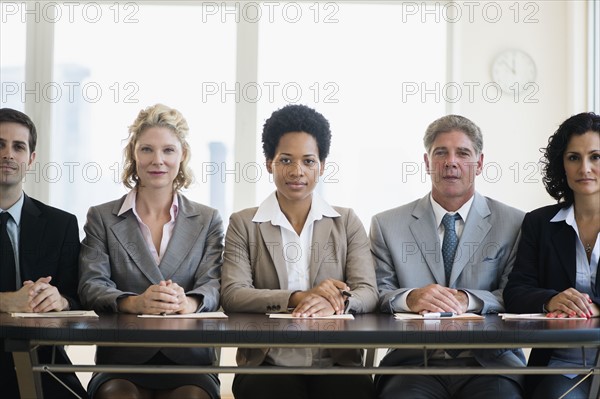 Office workers in conference room. Photo : Jamie Grill