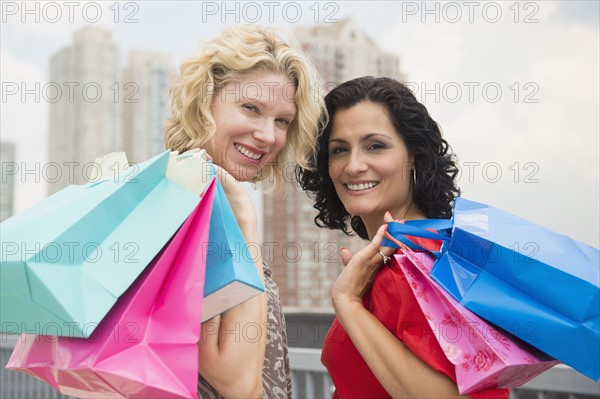 Female friends after shopping. Photo : Jamie Grill