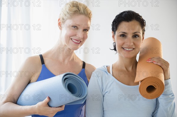 Female friends prepared for yoga class. Photo: Jamie Grill