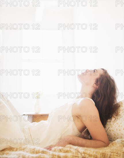 Portrait of young woman in white chemise. Photo : Daniel Grill