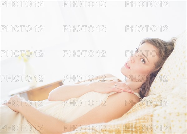 Portrait of young woman in white chemise. Photo : Daniel Grill