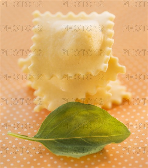 Studio Shot of ravioli and basil leaf. Photo : Daniel Grill