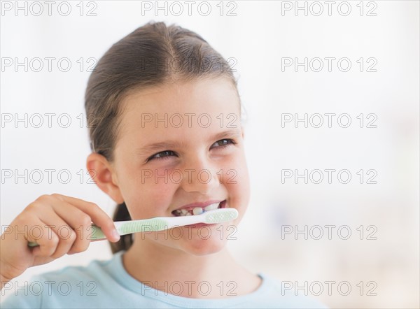 Young girl brushing her teeth. Photo: Daniel Grill