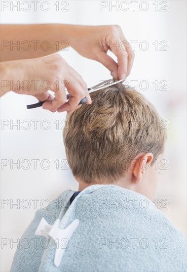 Young boy (6-7) undergoing haircut. Photo: Daniel Grill