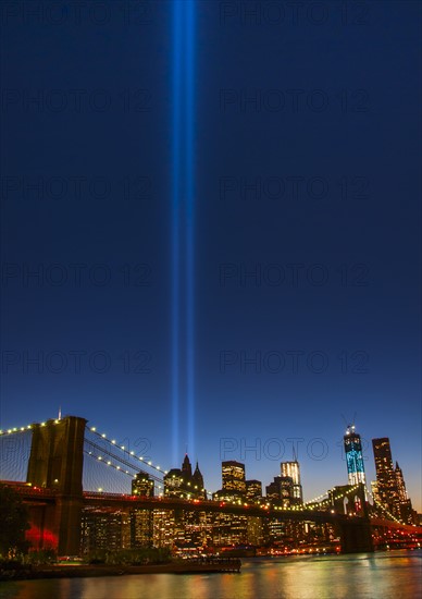 View over Hudson River towards Manhattan with September 11th memorial lights and Brooklyn Bridge. Photo : Daniel Grill