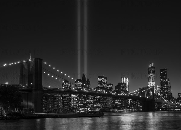 View over Hudson River towards Manhattan with September 11th memorial lights and Brooklyn Bridge. Photo : Daniel Grill