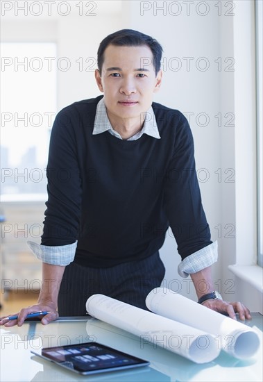 Mid adult architect working in his studio. Photo : Daniel Grill