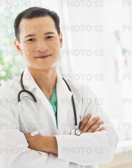 Portrait of happy mid adult doctor. Photo: Daniel Grill