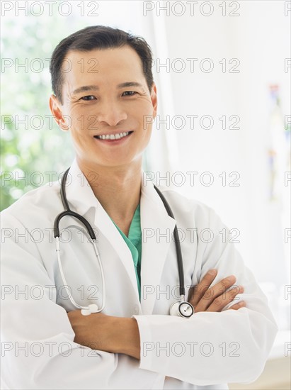 Portrait of happy mid adult doctor. Photo: Daniel Grill