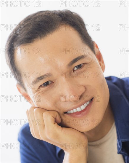 Portrait of happy mid adult man. Photo : Daniel Grill