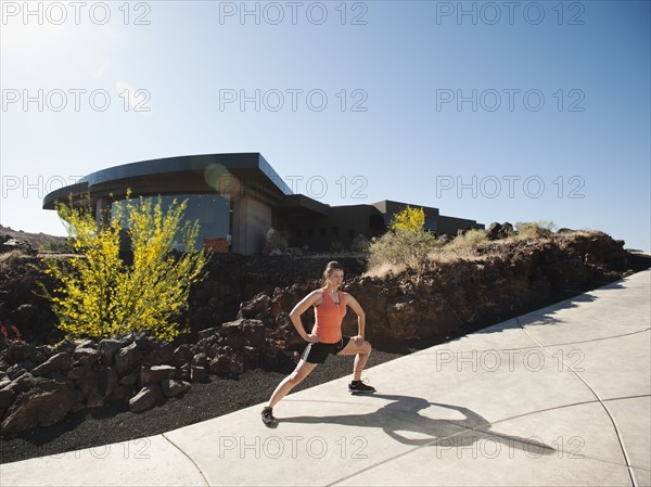 Young woman stretching.