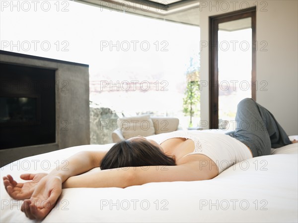Young attractive woman lazing in bed.