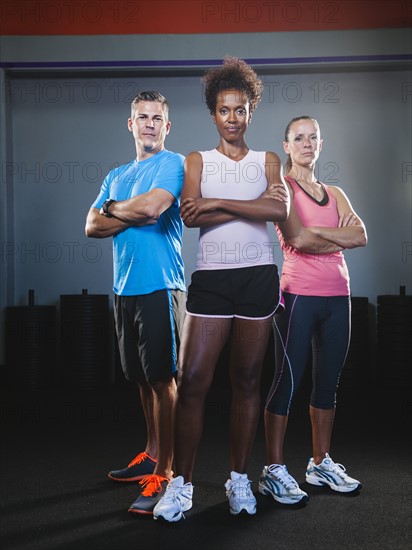 Portrait of three people in gym. Photo: Erik Isakson
