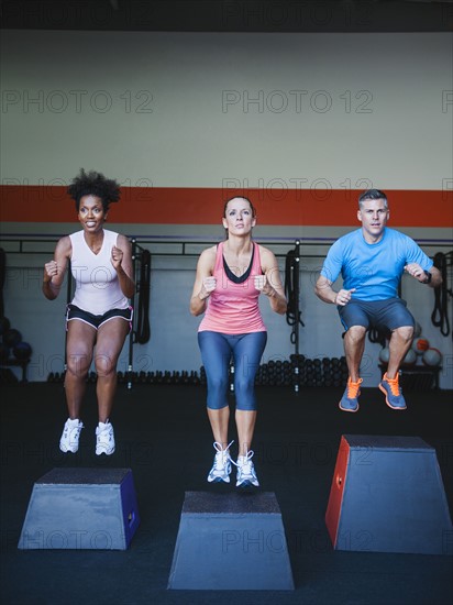 Three people in step aerobics class. Photo: Erik Isakson