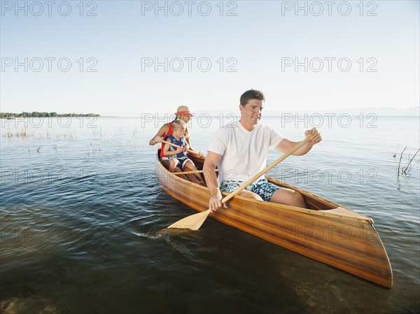 Family with son (4-5) canoe traveling.