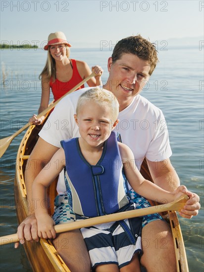 Portrait of family with son (4-5) canoe traveling.