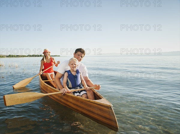 Portrait of family with son (4-5) canoe traveling.