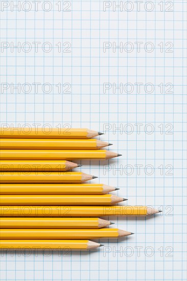 Grouping of yellow pencils in graph shape on graph paper. Photo : Kristin Duvall