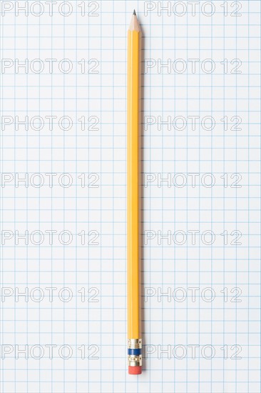 Single yellow sharpened pencil on graph paper. Photo: Kristin Duvall