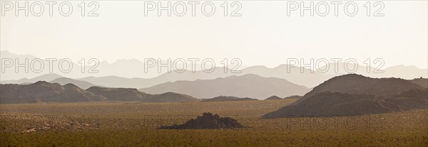 Several mountain ranges backlit by morning sun. Photo: Mike Kemp