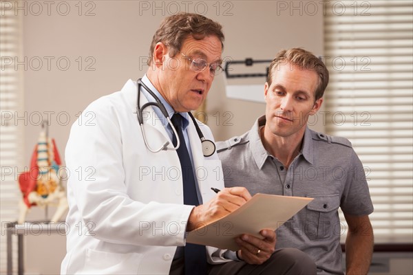 Doctor consulting with patient. Photo : Mike Kemp