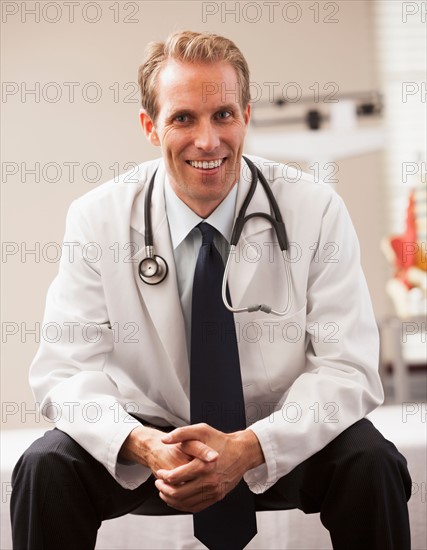 Portrait of doctor smiling. Photo : Mike Kemp