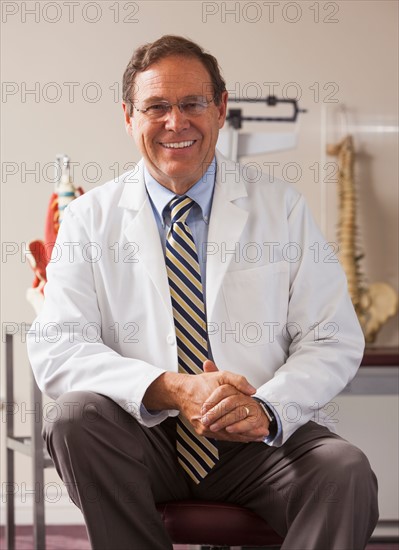 Portrait of doctor in his office. Photo : Mike Kemp