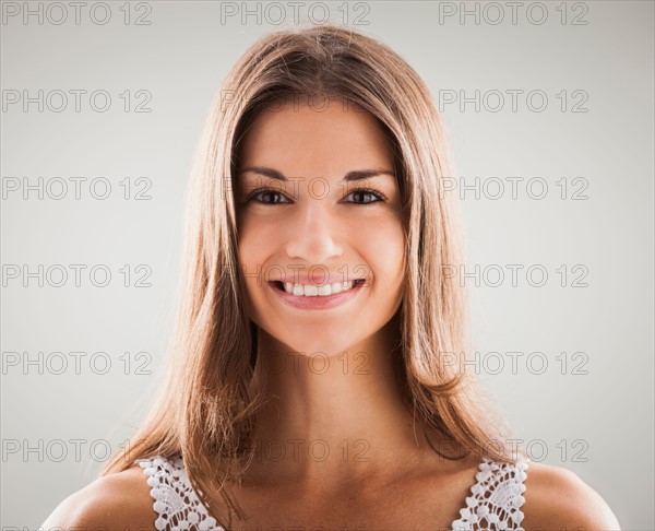 Sutdio shot of beautiful woman smiling. Photo: Mike Kemp