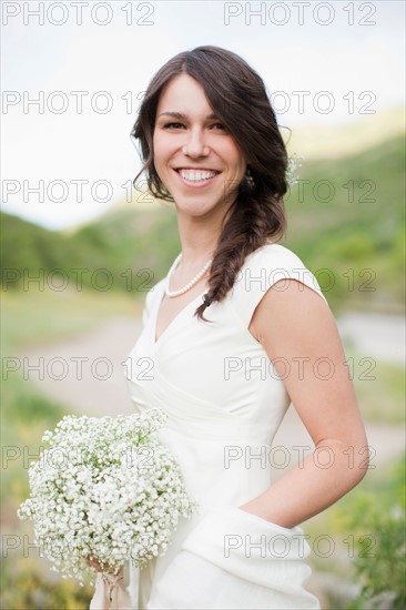 Portrait of smiling woman in white dress. Photo: Jessica Peterson