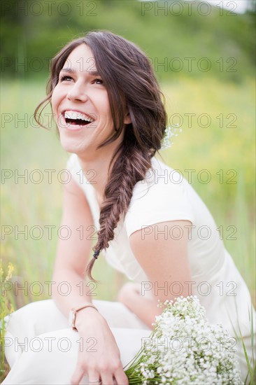 Portrait of laughing woman looking up. Photo : Jessica Peterson